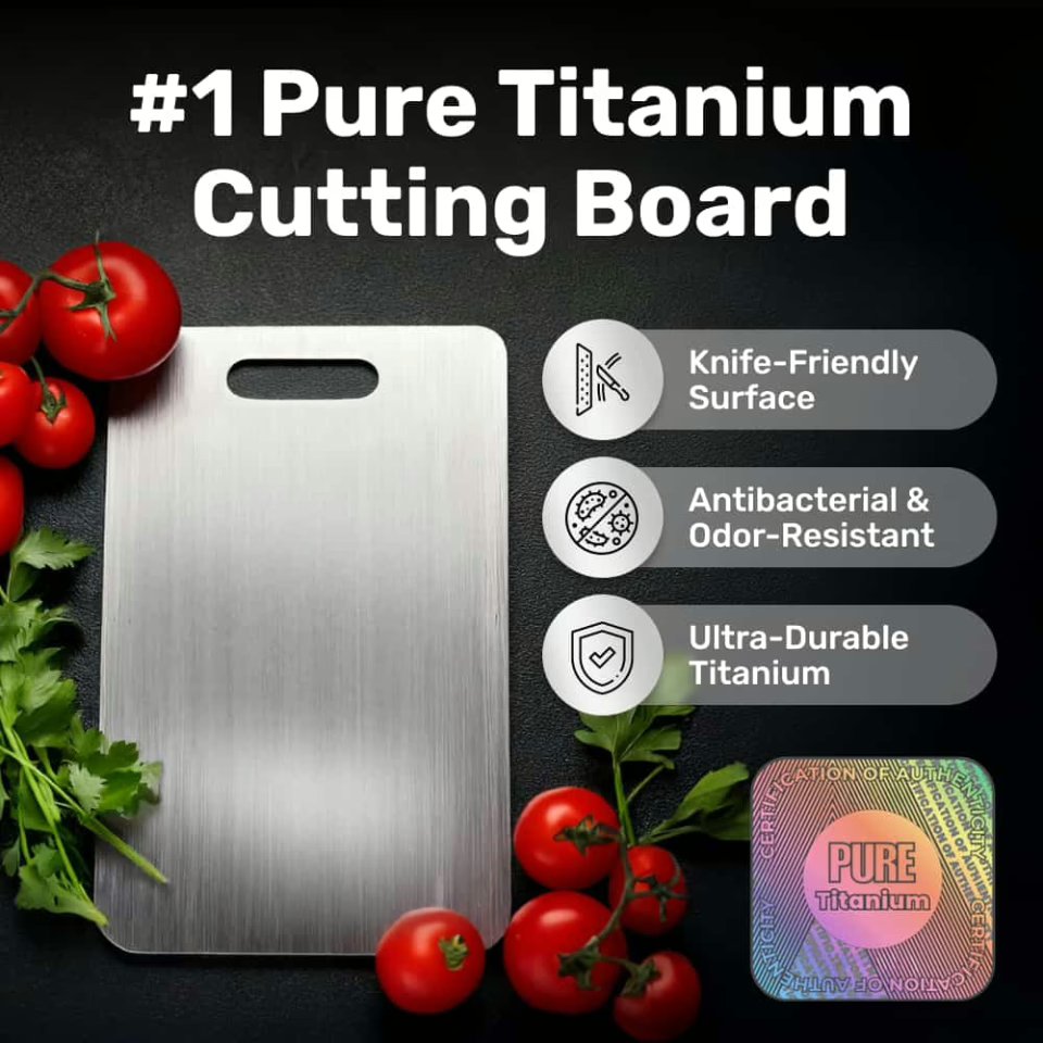 pure titanium cutting board with brushed silver metallic surface on a dark stone kitchen counter, su